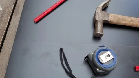 Construction tools in a table. Hammer, tape measure and pencils. Stock Footage 218383917
