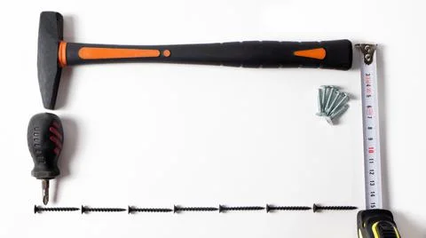 Construction tools on a white background with space for text. Stock Photos