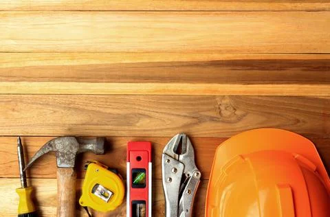 Construction tools on wood table background. Top view with copy space. Foto stock