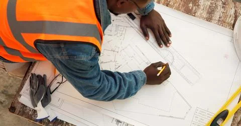 Construction, top view and man with blueprint sketch, civil engineering or Fotos de archivo