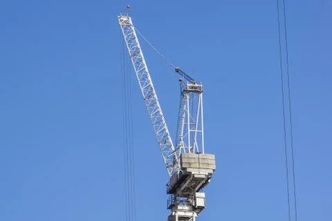 Construction tower crane against blue sky Stock Photos