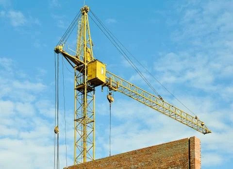 Construction tower crane on blue sky background Stock Photos