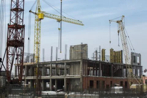 Construction tower crane on a building construction Stock Photos
