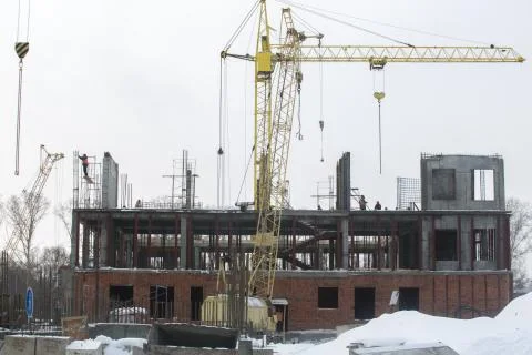 Construction tower crane on a building construction Stock Photos