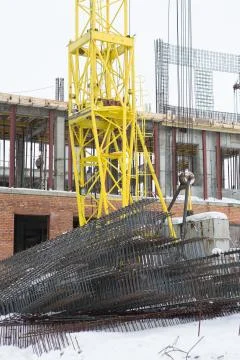 Construction tower crane on a building construction Stock Photos