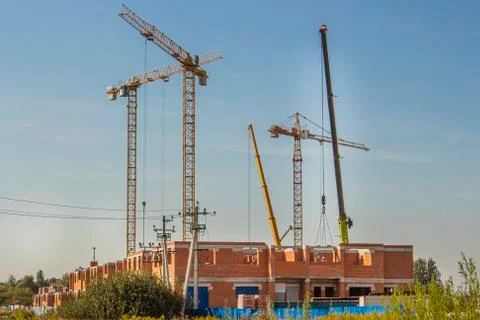Construction tower cranes are on the construction site 스톡 사진
