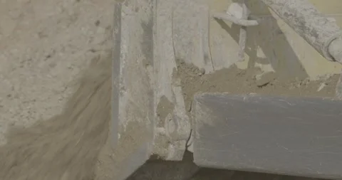 Construction, tractor leveling the ground with a bucket, brown earth, day Stock Footage 303407690