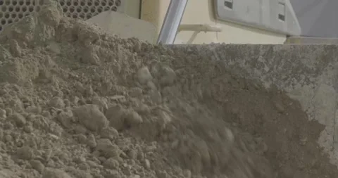 Construction, tractor leveling the ground with a bucket, brown earth, day Stock Footage 303407692