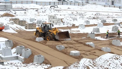 Construction tractor working on a construction site on winter day Stock-Footage 171826844