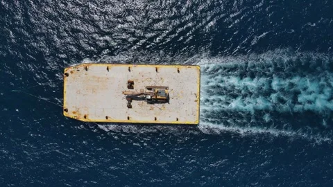 Construction trailer pulled through ocean water Stock Footage 294382695