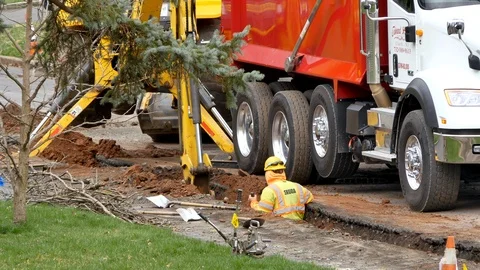 Construction trench digging wide shot Stock Footage 106365138