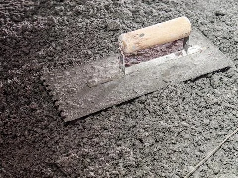 Construction Trowel on Fresh Concrete Surface Texture Stock Photos