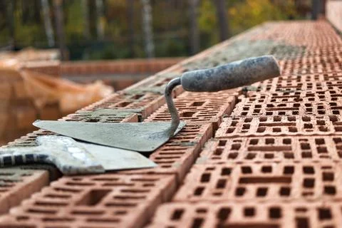 Construction trowel for laying bricks and blocks. Construction tool of a bric 스톡 사진