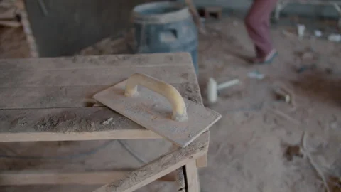 Construction trowel on wooden workbench at building site Vídeos de archivo 311560770