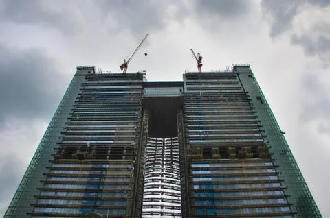 Construction of twin skyscraper Stock Photos