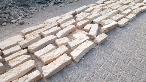 Construction using natural tiles and limestone. Natural hewn stone Stock Footage 346083037