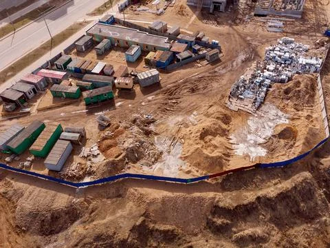Construction vans, cabins are surrounded by a fence, top view. Construction site Stock Photos