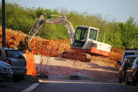 A construction vehicle with a crane in the back Stock Photos
