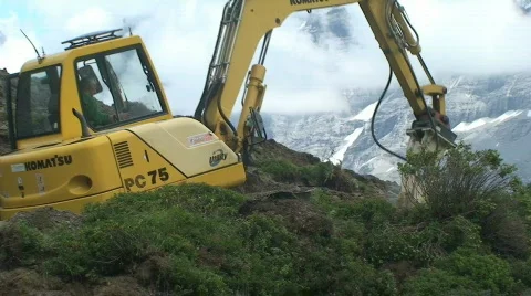 Construction vehicle in front of eiger 3 Stock Footage 809171