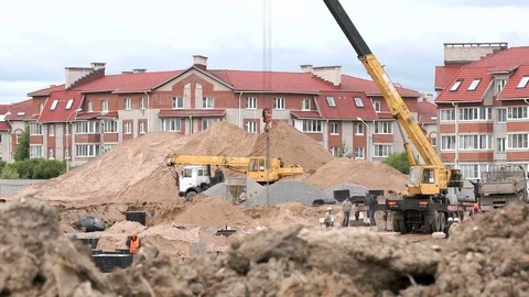 Construction vehicles and builders outdoors Stock Footage 77611261