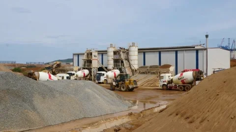 The construction vehicles in the concrete batch plant are busy working to make 스톡 동영상 130885494