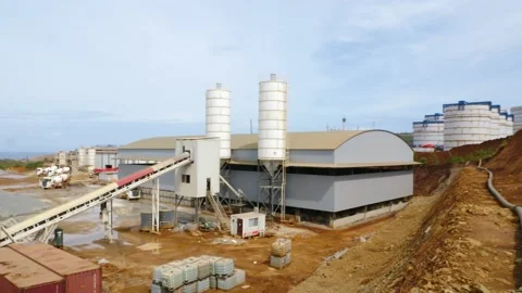 The construction vehicles in the concrete batch plant are busy working to make 스톡 동영상 130885886