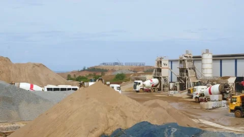 The construction vehicles in the concrete batch plant are busy working to make 스톡 동영상 130885960