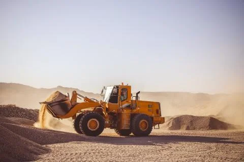 Construction Vehicles in Desert working Stock-Fotos