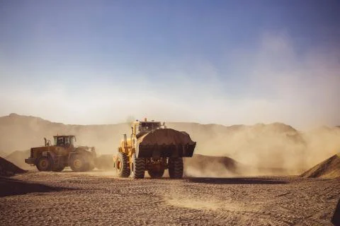 Construction Vehicles in Desert working Stock-Fotos