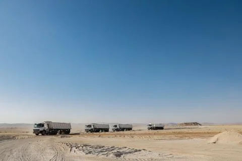Construction Vehicles in Desert working Stock-Fotos