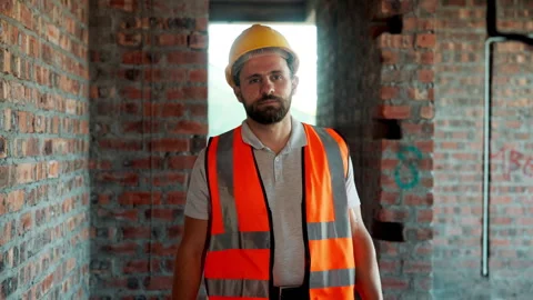 Construction, vest and walking with man on building site for design or property Stock Footage 336189518