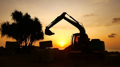 Construction Video At construction site The silhouette excavator is digging g Stock Footage 99128886