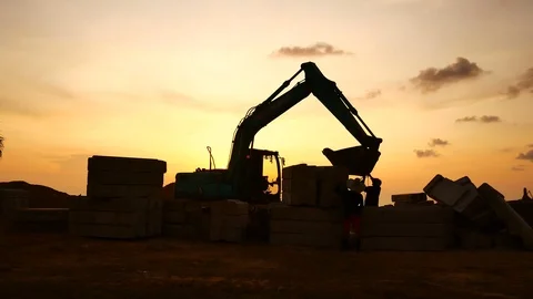 Construction Video At construction site The silhouette excavator is digging g Stock Footage 99128968