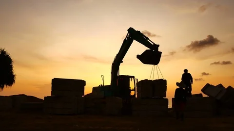 Construction Video At construction site The silhouette excavator is digging g Stock Footage 99128988