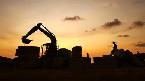 Construction Video At construction site The silhouette excavator is digging g Stock Footage 99129016