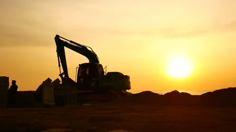 Construction Video At construction site The silhouette excavator is digging g Stock Footage 99129046