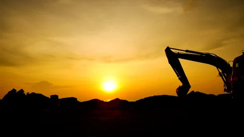 Construction Video At construction site The silhouette excavator is digging g Stock Footage 99129066