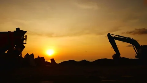 Construction Video At construction site The silhouette excavator is digging g Stock Footage 99129102