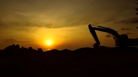 Construction Video At construction site The silhouette excavator is digging g Stock Footage 99129106