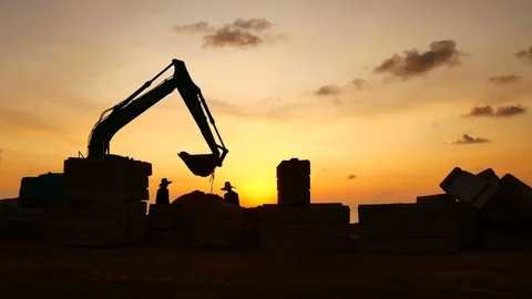 Construction Video At construction site The silhouette excavator is digging g Stock Footage 99129149