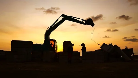 Construction Video At construction site The silhouette excavator is digging g Stock Footage 99129179