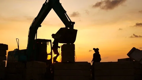 Construction Video At construction site The silhouette excavator is digging g Stock Footage 99129209