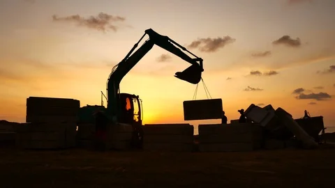 Construction Video At construction site The silhouette excavator is digging g Stock Footage 99129249