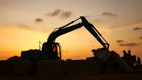 Construction Video At construction site The silhouette excavator is digging g Stock Footage 99129352