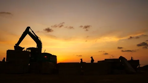 Construction Video At construction site The silhouette excavator is digging g Stock Footage 99129390