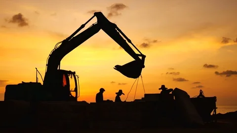 Construction Video At construction site The silhouette excavator is digging g Stock Footage 99129475