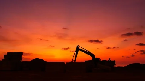 Construction Video At construction site The silhouette excavator is digging g Stock Footage 99129502