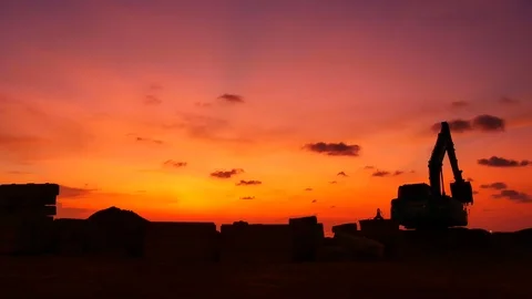 Construction Video At construction site The silhouette excavator is digging g Stock Footage 99129584