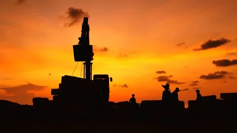 Construction Video At construction site The silhouette excavator is digging g Stock Footage 99129728
