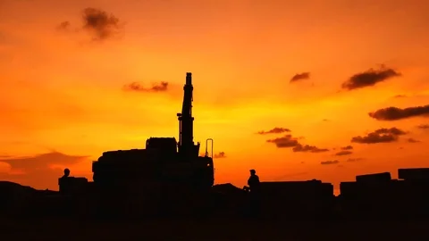 Construction Video At construction site The silhouette excavator is digging g Stock Footage 99129835